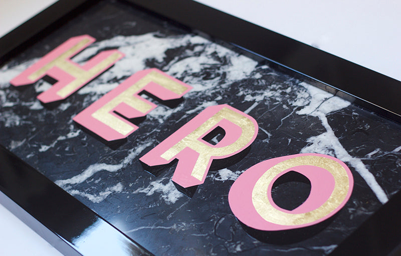 Hero Original Piece painted with lettering enamel on black marquina polished marble stone. Hand finshed with gold leaf - Daisy Emerson